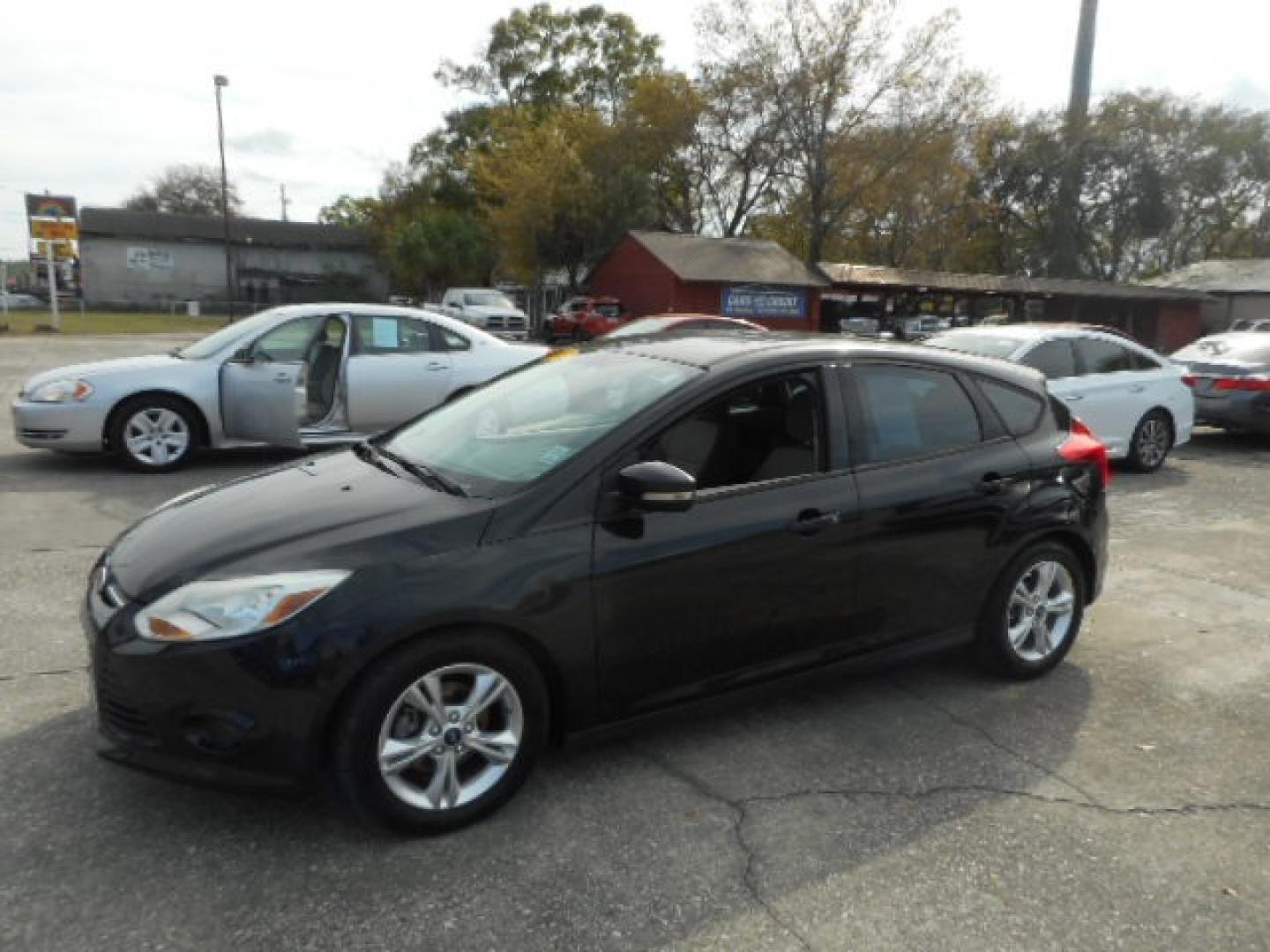 2014 BLACK FORD FOCUS SE (1FADP3K25EL) , located at 10405 Abercorn Street, Savannah, GA, 31419, (912) 921-8965, 31.988262, -81.131760 - Photo#1